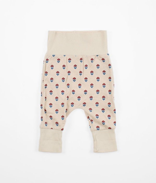 Béžové tepláčky s květy MOTHERCARE